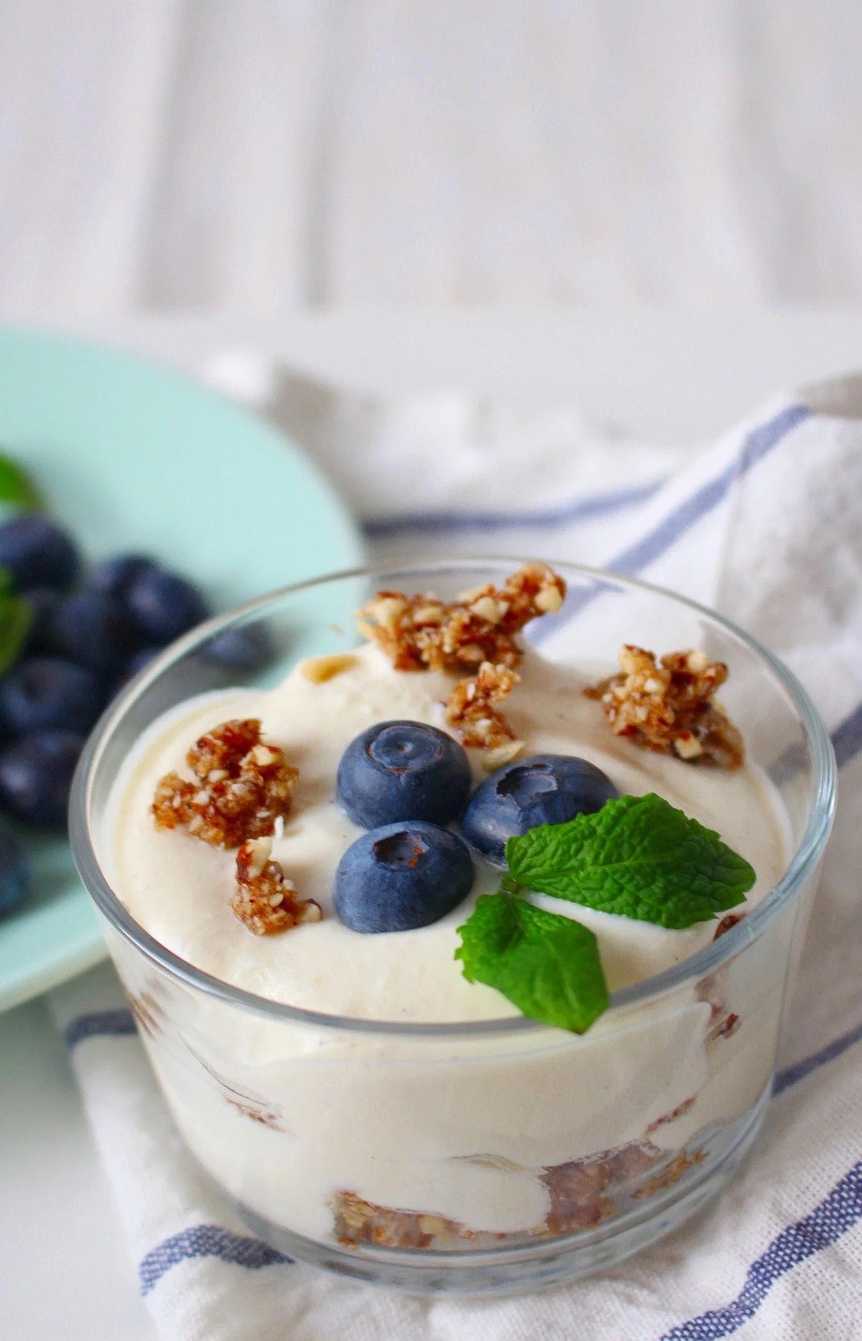 Cultured dairy dessert with blueberries and mint